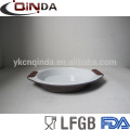 Bandeja de bolo redonda revestida cerâmica do aço carbono com o punho do aperto do silicone